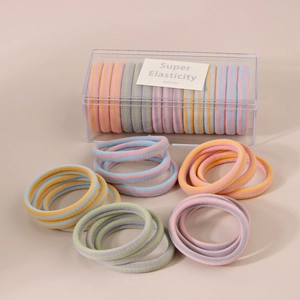 Detailed view of 15 pieces of colorful high elastic hair ties in a clear storage box