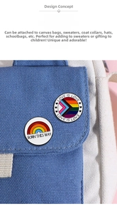 Detail of rainbow enamel pins with Love Is Love and Born This Way on a canvas bag