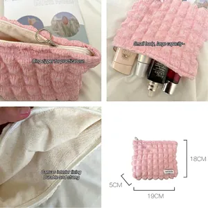Pink bubble fabric makeup bag with metal ring zipper and 19x18x5cm compact size