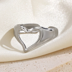 Polished silver stainless steel open ring with heart cutout on elegant satin surface