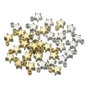Gold and silver star charms for jewelry making with polished metallic finish on white