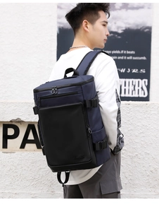 Side view of waterproof navy blue business backpack featuring multi-layer storage pockets