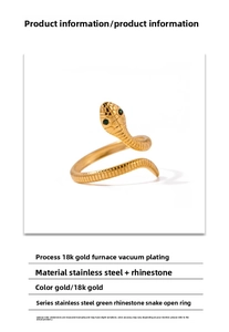 Close-up of snake ring with 18K gold plating, green rhinestone eyes and scale texture