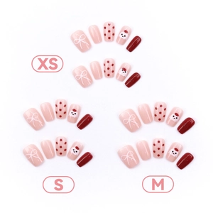 Red polka dot and puppy pattern press-on nails set in XS, S, M size variations