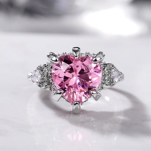 Luxurious silver ring with a heart-shaped pink zircon and micro-pave diamond accents