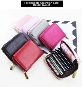 Detailed view of multi-color accordion card holders in textured litchi leather finish