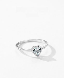 Macro shot of s925 silver heart shaped ring featuring a sparkling diamond solitaire