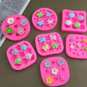 Pink silicone molds for flower and bow shaped cake decorations and chocolate crafting