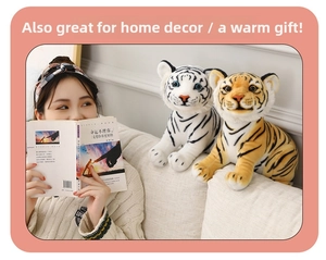 Realistic tiger plush toys in white and yellow shown held in a cozy home setting