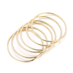 Set of seven minimalist 3mm 18k gold plated stainless steel stackable bangles for women