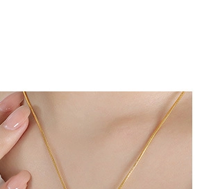 Close-up of a gold star tassel pendant necklace on a model's neck for a stylish look