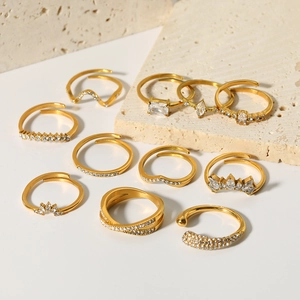 Stackable set of 10 gold plated titanium steel rings with irregular zircon accents