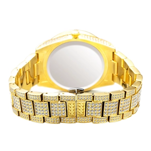 Macro view of gold iced-out watch band and secure folding clasp with crystal accents