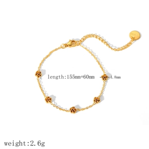 Gold plated stainless steel bracelet featuring five delicate rose flower charms on a thin chain