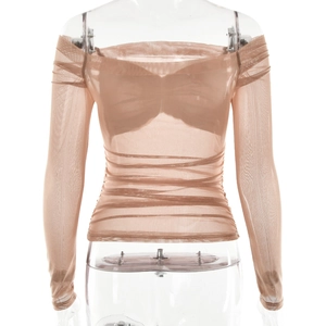 Detail view of sheer mesh off-shoulder long sleeve top with ruching in nude beige