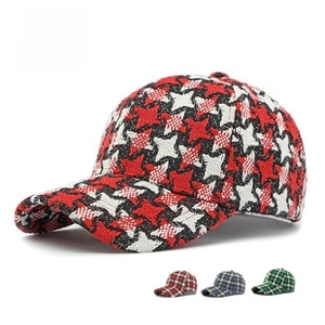 Detail of tweed baseball cap showing red and white star texture and color swatches