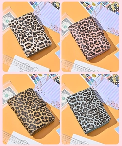 A6 leopard budget binder set showing four color variants and planning accessories
