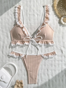 Two-piece ribbed knit bikini in dusty pink with white lace trim and drawstring tie