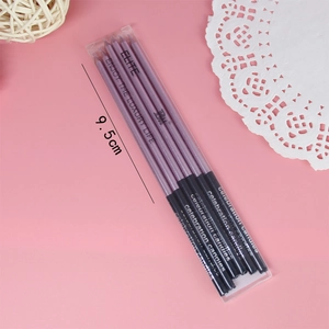 Detail of 4-piece purple spiral birthday candles with elegant metallic finish and holders