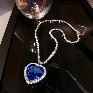 Macro shot of Heart of the Ocean necklace with deep blue crystal and sparkling rhinestones