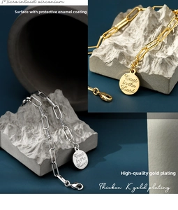 Macro view of gold and silver chain bracelet with micro-set zircon and engraved coin charm
