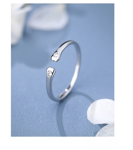 Macro detail of S925 sterling silver open ring with sparkling round cubic zirconia stones