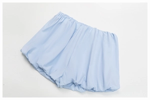 Detailed view of sky blue yoga shorts with elastic waist and ruched fabric texture