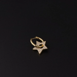 Detailed view of single gold hoop earring with star pendant and micro-set cubic zirconia