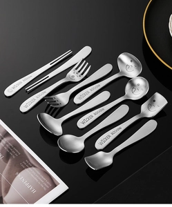 Close-up of matte 304 stainless steel cutlery set with smiley face engraving
