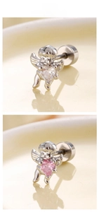Detailed view of Cupid angel earrings with heart zircon and screw back closure
