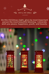 Close-up of three lighted Christmas phone booth lanterns with Santa and snowman scenes