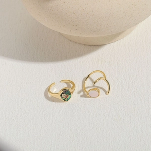 Golden open rings set featuring oval abalone shell and pink zircon stones in luxury style