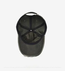 Internal view of washed denim baseball cap featuring black sweatband and stitched seams