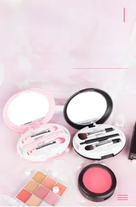 Close-up of portable makeup brush set with built-in mirror and compact storage case