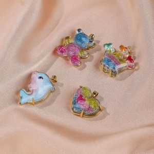 Sparkly resin cartoon pendants in bear heart and dolphin shapes for DIY jewelry making