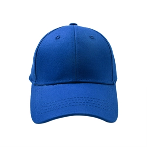 Detail view of a navy blue cotton baseball cap showing reinforced stitching and eyelets