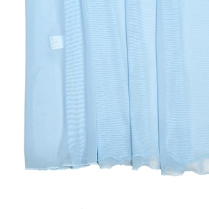 Detailed view of the light blue mesh fabric texture and wash care label showing size S