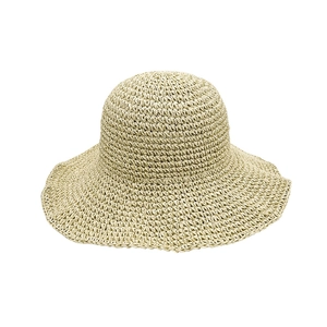 Women's foldable wide-brim straw hat in beige, perfect for beach sun protection