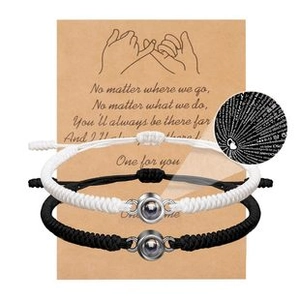 Detail of couple bracelets with nano projection stone and romantic packaging card