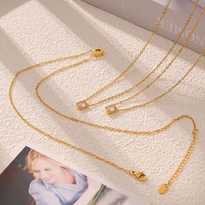 Minimalist gold plated titanium steel necklace with oval zircon pendants and thin chain
