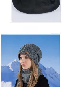 Close-up of thick fleece lining and grey knit beanie set against snowy mountains