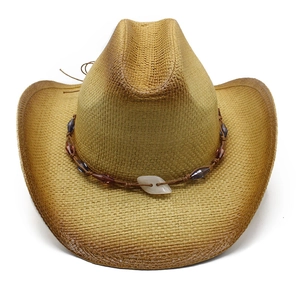 Detail of western straw cowboy hat with ombre spray paint and beaded leather band
