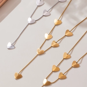 Elegant 18k gold heart tassel necklace with snake chain and matte metal finish