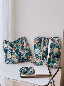 Detail of floral canvas tote bags and matching hair scrunchie in oil painting style