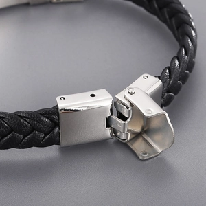 Men's black braided leather bracelet with silver stainless steel clasp on grey background