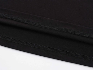 Detail of double-needle stitching and fine knit cotton texture on black slim-fit T-shirt