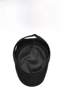 Detail view of the breathable mesh lining and adjustable metal buckle on black flat top cap