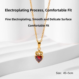 Detail of red heart zircon necklace with gold crown clasp and adjustable 45+5cm chain