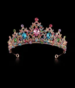 Baroque queen crown detail showing colorful crystals and pink heart-shaped center gem