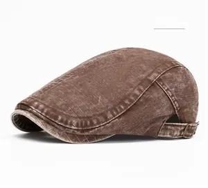 Detail of coffee vintage washed canvas newsboy cap with metal buckle and grid texture
